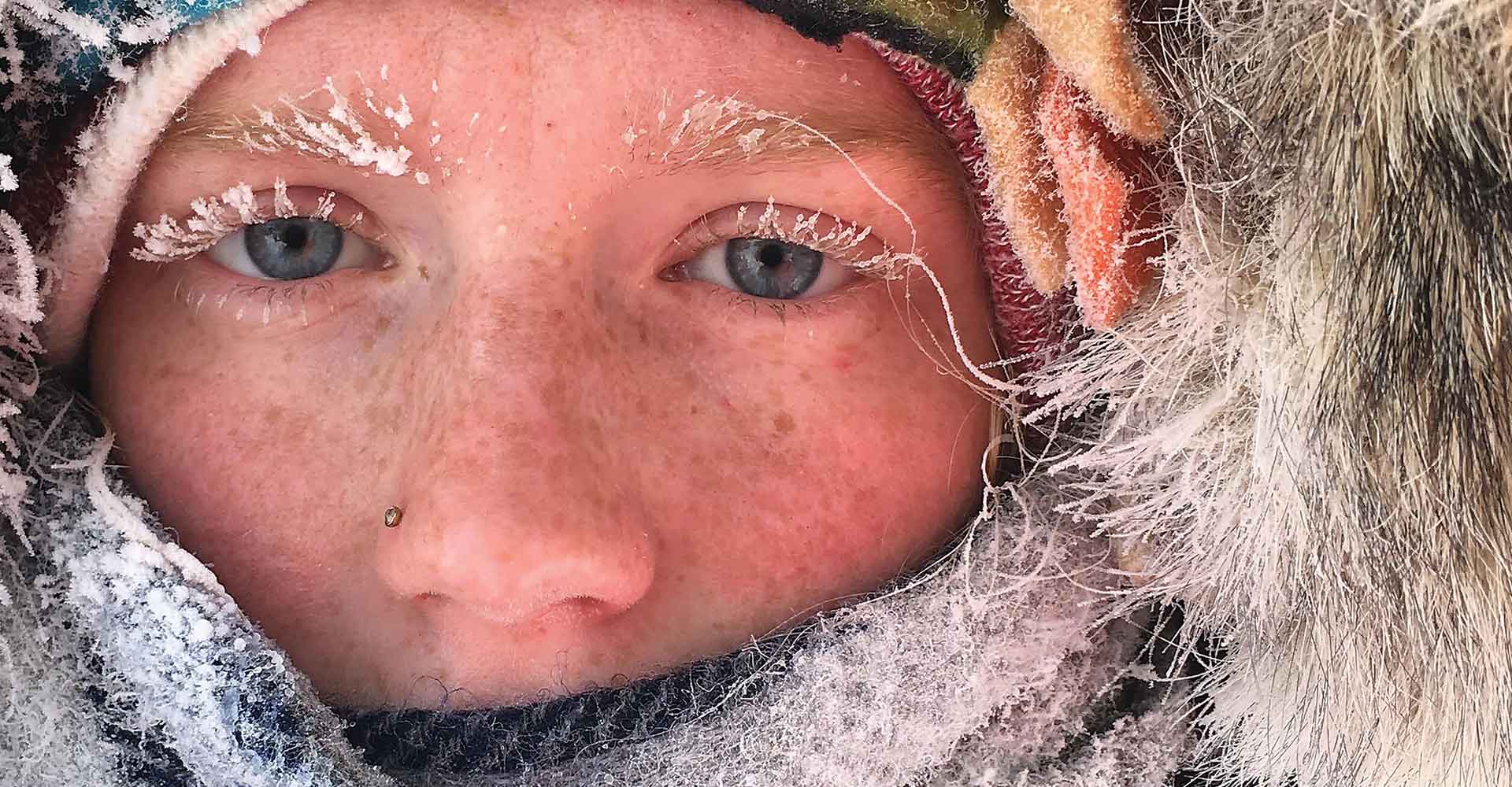 Close up of Agnes Scott Summit student's face, in a parka with frost on their eyelashes.